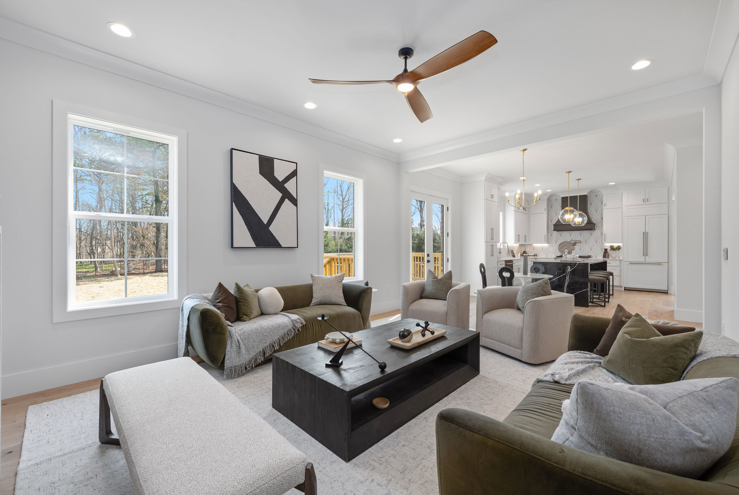 Open living room with sectional seating and large windows